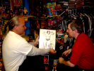 George & David look at a drawing of Andre that was used for local promos.